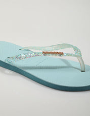 CHANCLAS HAVAIANAS SLIM GLITTER FLOURISH en color Azul marino