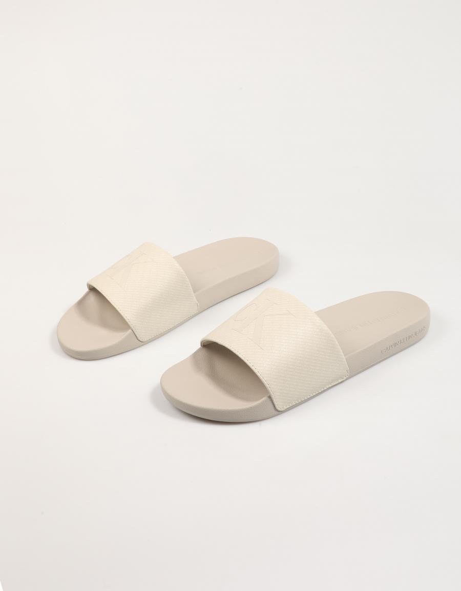 Chanclas Calvin Klein Miami Slide AOP Print en Farbe Beige