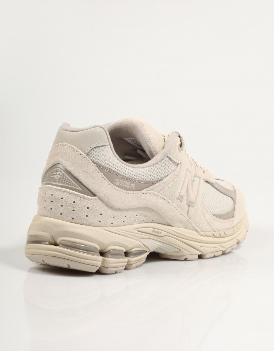 Baskets NEW BALANCE U2002 en couleur beige