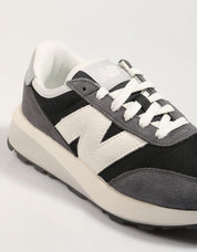 Turnschuhe NEW BALANCE u370 in schwarzer Farbe