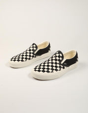 ZAPATILLAS VANS SLIP ON WHITE/BLACK en color Negro