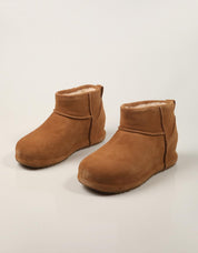 BOTINES UGG MINI ENWRAP CHESNUT 1180412 en color Cuero